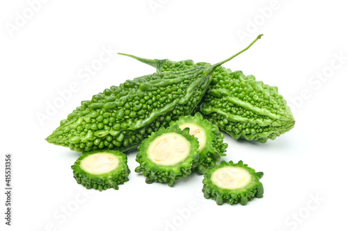 Bitter melon or Bitter gourd with slices on white background