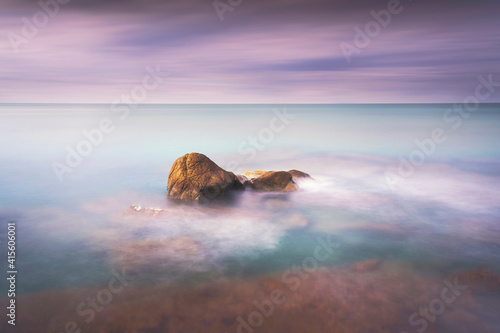 Rocks and soft sea, long exposure photography landscape.