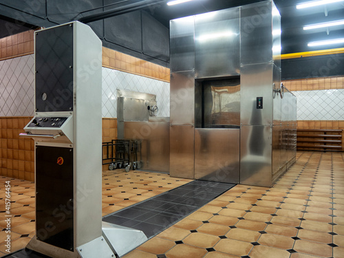 room in a crematorium with a modern stainless steel oven