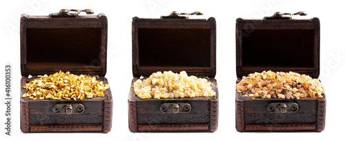 Gold Frankincense and Myrrh in three Chests on a White Background