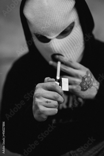 gangster lighting up a cigarette