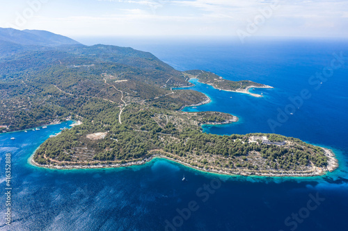 Aerial drone high angle shot of peninsula of Vis Island coastline in Adriatic sea in Croatia summer