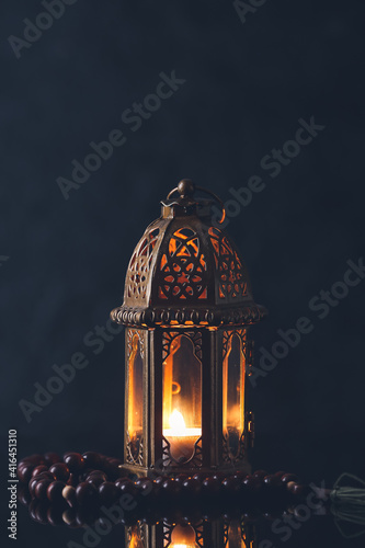 Muslim lamp and tasbih on dark background