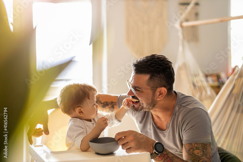 Single dad feeding his baby 