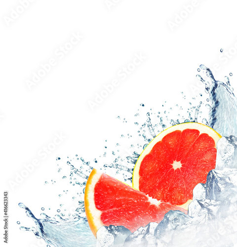 grapefruit splash with water and ice cubes isolated on white background