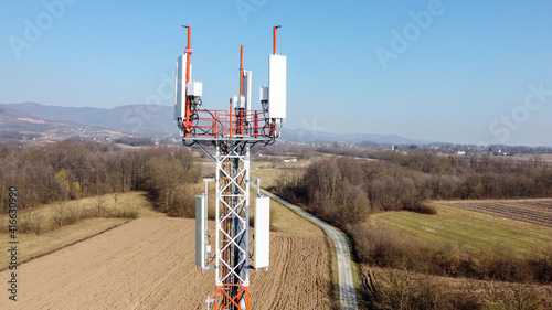 Aerial drone view of GSM and radio telecommunication tower. Cell phone tower. Base transceiver station. Wireless communication antenna transmitter. 