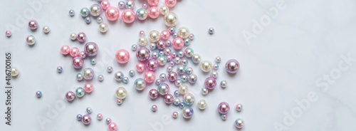 Pearls background. Pearls on marble background. Fashion and luxury jewelry concept