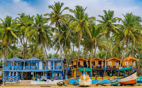 Colorful bungalows on the tropical beach of Palolem, beachfront resort