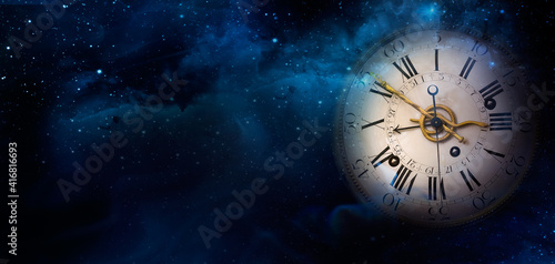 Mystical image of a Clock face of the old watch on the night sky background with stars. Philosophy image of space time dimension and time transience.