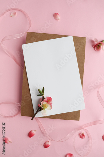 postcard mockup. spring flowers. flowering branches on a white background, envelope and white blank for text 