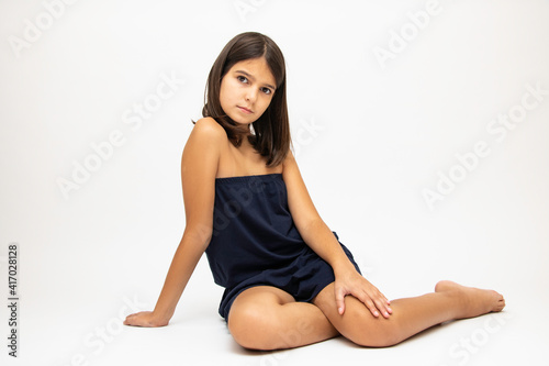 Girl, schoolgirl meditates, expresses emotions, close-up on a white background
