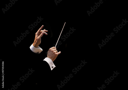 Conductor's hands on a black background