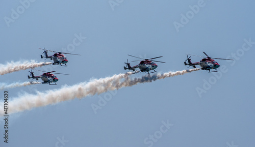 Indian Air Force Sarang helicopter air display team in formation flying HAL Dhruv aircraft.