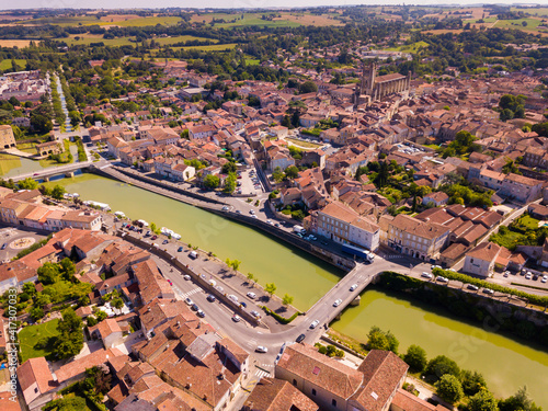 Panoramic aerial view of Condom city on Baise river on sunny summer day, Gers, France