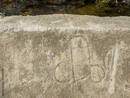 dick streetart in bhutan on stone wall background