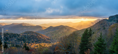 Colorful setting autumn sun on the southern stretch of Blue Ridge Parkway - North Carolina Cowee Mountain Overlook
