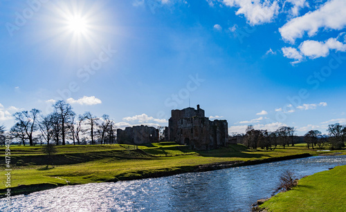 Sun shining over Brougham Castle and the river Eamont