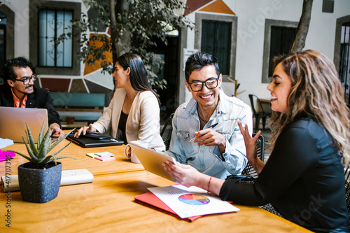 mexican business people discussing a project plan in office in Latin America