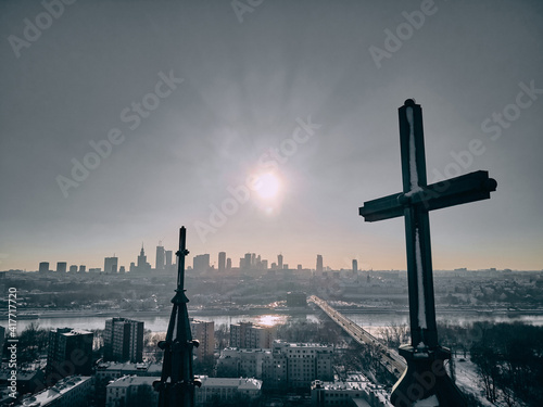 Beautiful panoramic aerial drone view of the Warsaw City Centre through two church towers with huge crosses - St. Florian Cathedral, Warsaw, Poland, EU