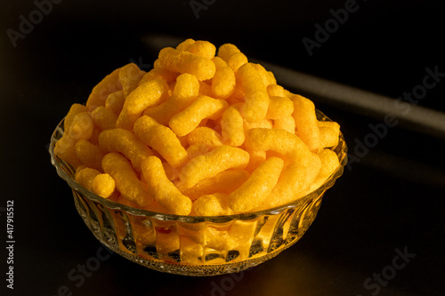 cheese puffs in a glass bowl, Cheese Doodle Day, crisps, puffcorn
