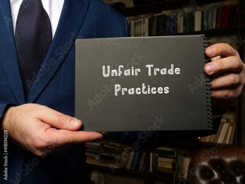 Legal concept about Unfair Trade Practices with phrase on the sheet.