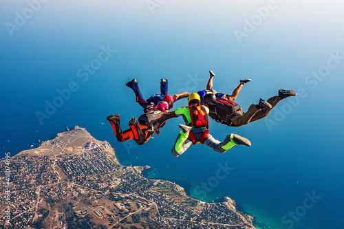 Skydiving group over the sea