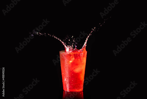 Splash drink cocktail, black background 