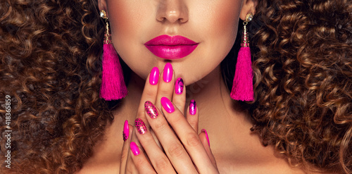 Luxury fashion style, manicure pink nail , cosmetics and make-up . Jewelry , large Fuchsia tassels earrings 