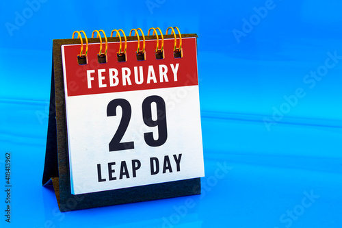 A calendar page on February 29 on a leap day on a blue background. Concept: Leap Year