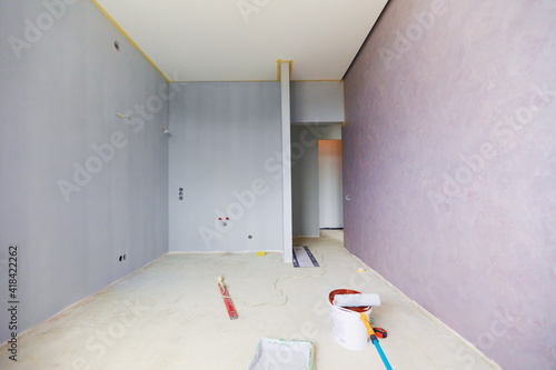 a new apartment repair finishing works in progress, plastering, painting and flooring constraction