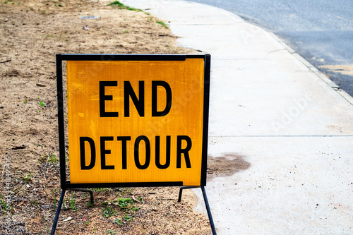 Yellow traffic end detour sign