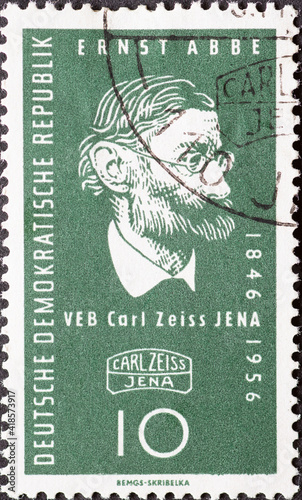 GERMANY, DDR - CIRCA 1956 : a postage stamp from Germany, GDR showing a half-length portrait of the physicist and social reformer Ernst Abbe, Zeiss symbol. 110 years of Carl Zeiss-Werke Jena