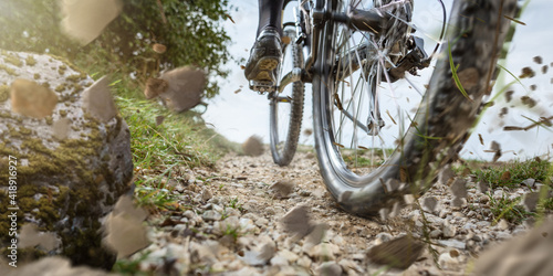 Mountain bike wheel on a gravel track