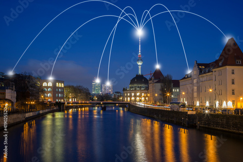 Smart city and connection lines. Spree River and urban skyline in Berlin, Germany, at dusk. Technology, network connection, information and smart city concept.