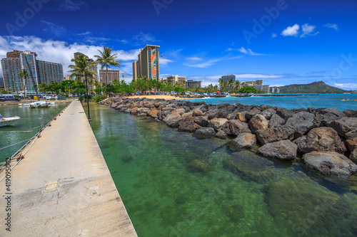Waikiki, Oahu, Hawaii, United States - August 18, 2016: view of the Hilton Hawaiian Village and the Duke Kahanamoku Beach in Waikiki from Ala Wai Harbor the largest yacht harbor of Hawaii.