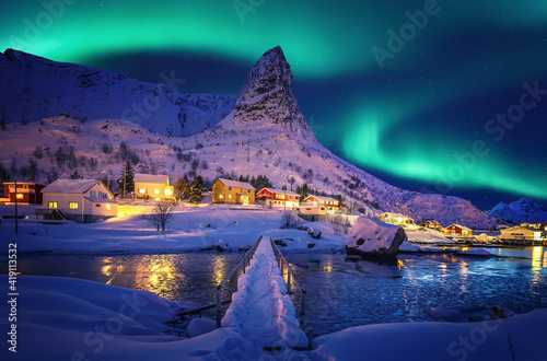 Amazing wintry landscape of Lofoten. Fantastic Winter seascape during sunset. majestic mountains with northern lights. picturesque nature scenery. creative image. Nature background. Traveling concept