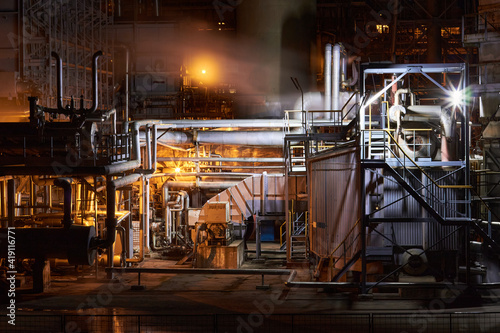 Petrochemical plant in night. Ammonia synthesis complex. Long exposure selective focus photography.