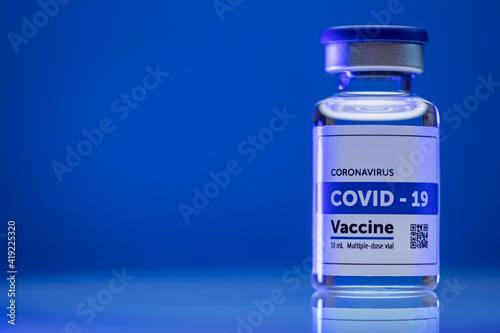 CoronaVirus vaccine vile on blue background