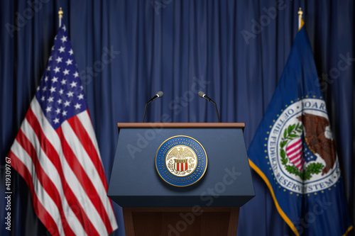 Federal Reserve System Fed of USA chairman press conference concept. Tribune with symbol and flag of FRS and United States.