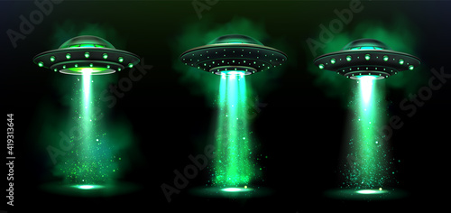 3d UFO, vector alien space ships with green light beam, smoke and sparkles. Saucers with bright illumination and vertical ray for abduction, unidentified flying objects, Realistic vector illustration