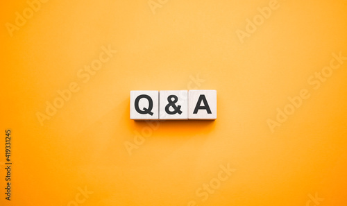 Q and A, questions and answers on wooden cubes. Concept