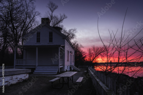 The historic Jones Point Lighthouse in Old Town Alexandria along the Potomac River at sunrise.