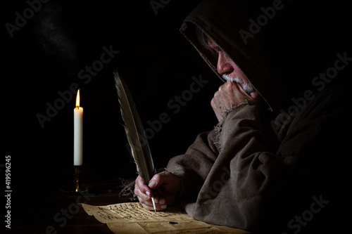 Medieval poor monk writes letter