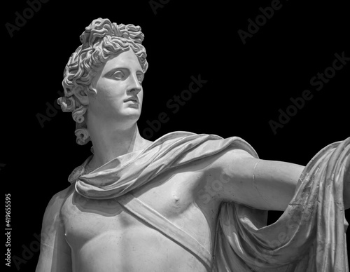 God Apollo bust sculpture. Ancient Greek god of Sun and Poetry Plaster copy of a marble statue isolated on black