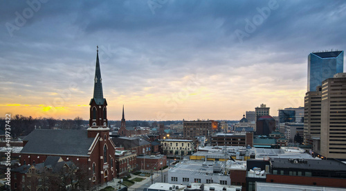 Aerial view of Lexington, Kentucky skyline during sunrise. Tall office buildings visible on the right side of the image.