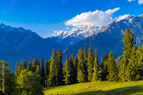 Landscape in the summer. These are the scenic meadows of the Himalayas. Peaks and alpine landscape from the trail of Sar Pass trek Himalayan region of Kasol, Himachal Pradesh, India.