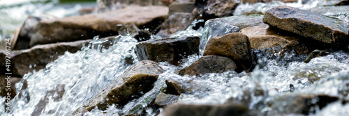 Close up of river stream on stones