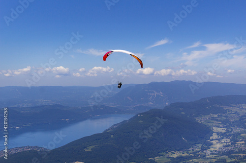 paragliding sport on Mont Revard french alpes mountains with lake Bourget view Savoie region France Europe 