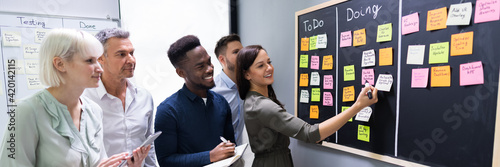 Group Of People Writing On Sticky Notes