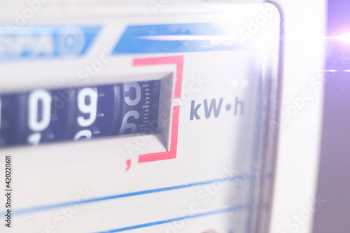 macro view of electricity watt meter, kilowatt calculator counter at home, savings economy